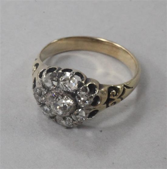 A Victorian gold and old mine cut diamond cluster ring, size M.